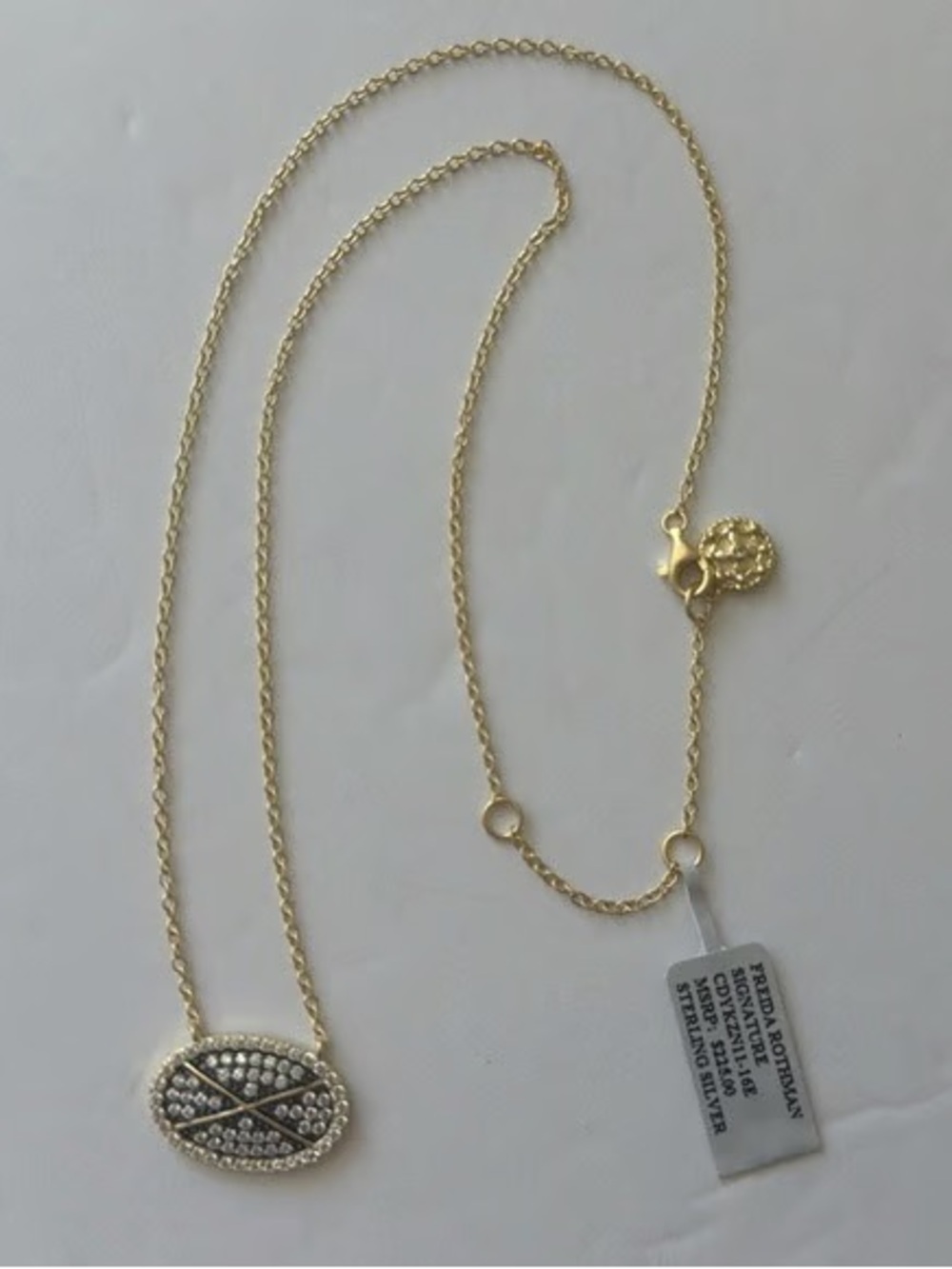 Freida Rothman Gold-Tone Pavé Oval criss cross Pendant Necklace